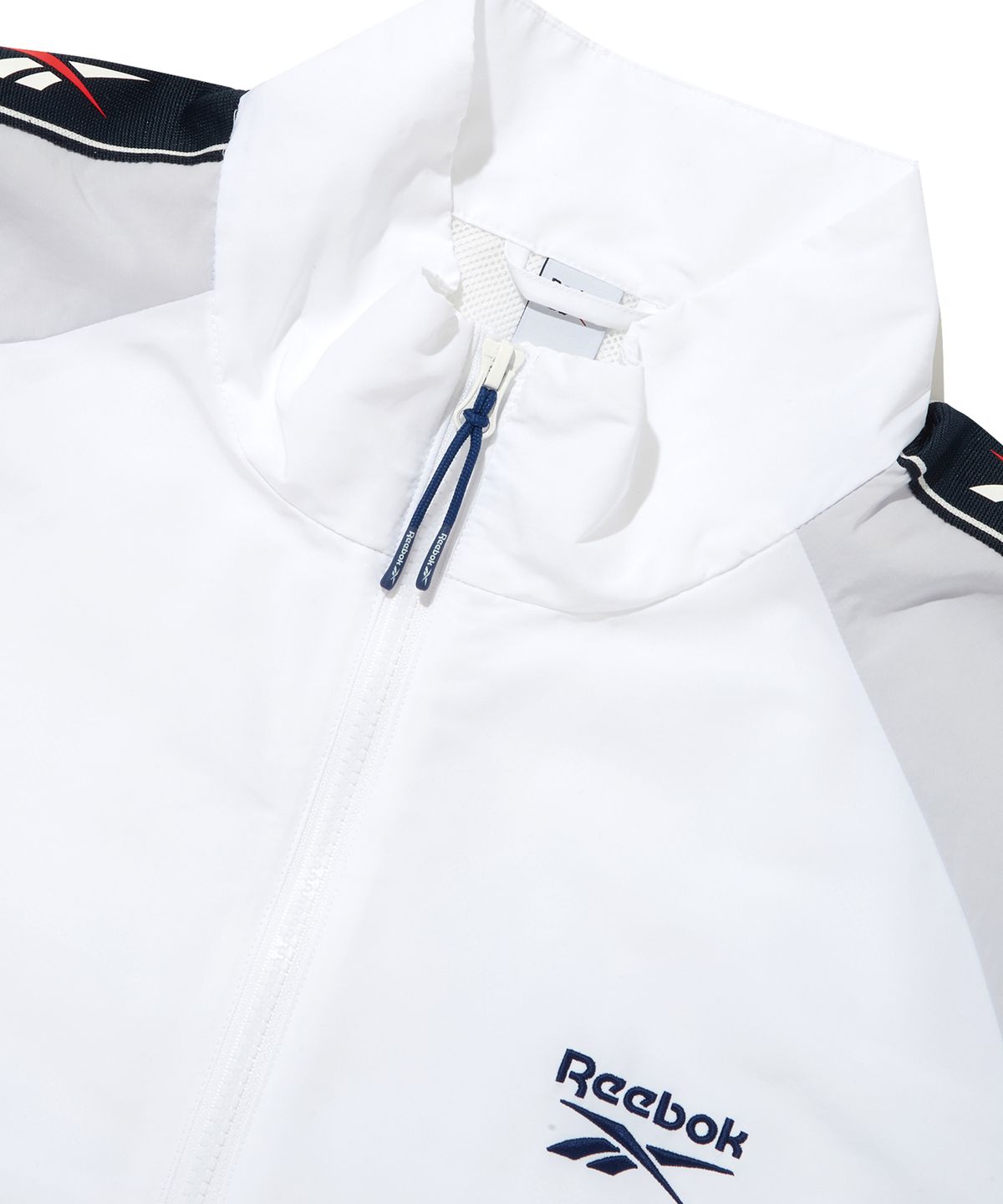 리복(REEBOK) 벡터 블록 반팔 아노락 - 오프 화이트:블루