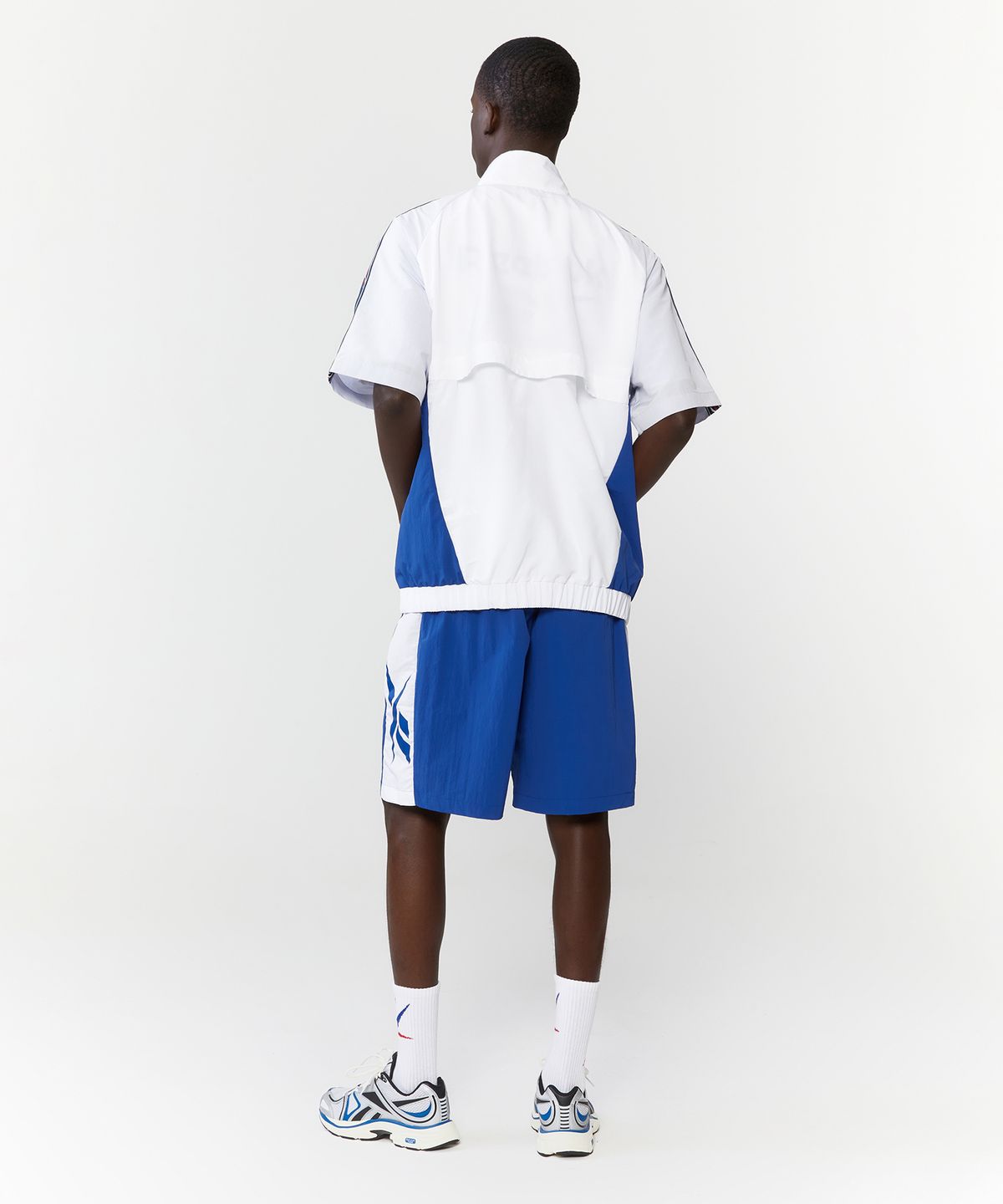 리복(REEBOK) 벡터 블록 반팔 아노락 - 오프 화이트:블루