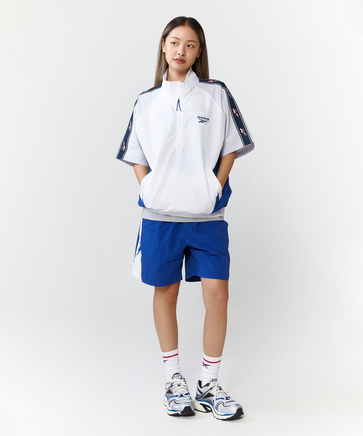 리복(REEBOK) 벡터 블록 반팔 아노락 - 오프 화이트:블루