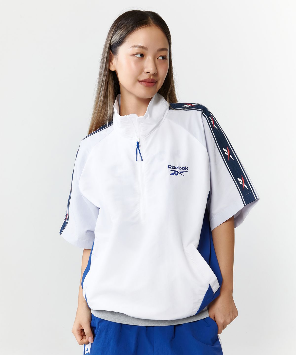 리복(REEBOK) 벡터 블록 반팔 아노락 - 오프 화이트:블루