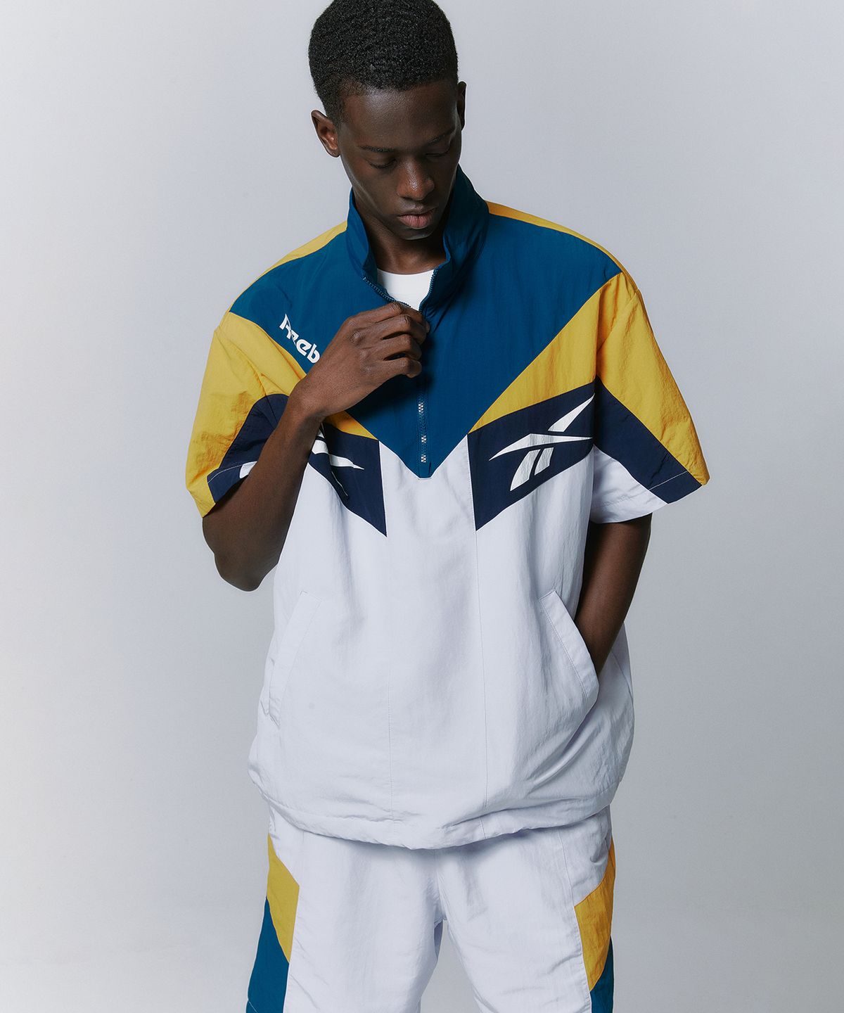 리복(REEBOK) TWIN VECTOR 반팔 아노락 - 그린