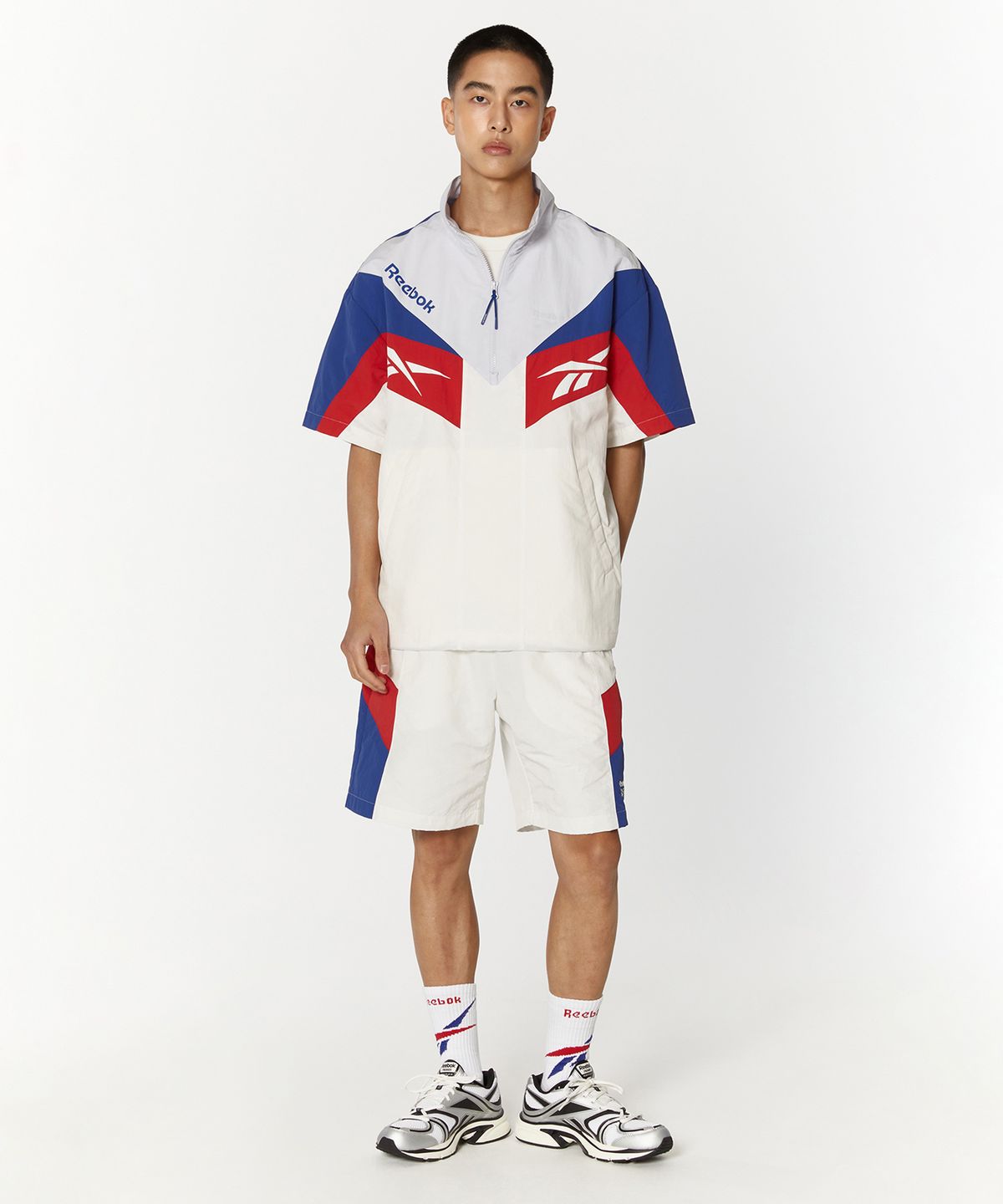 리복(REEBOK) TWIN VECTOR 반팔 아노락 - 오프 화이트
