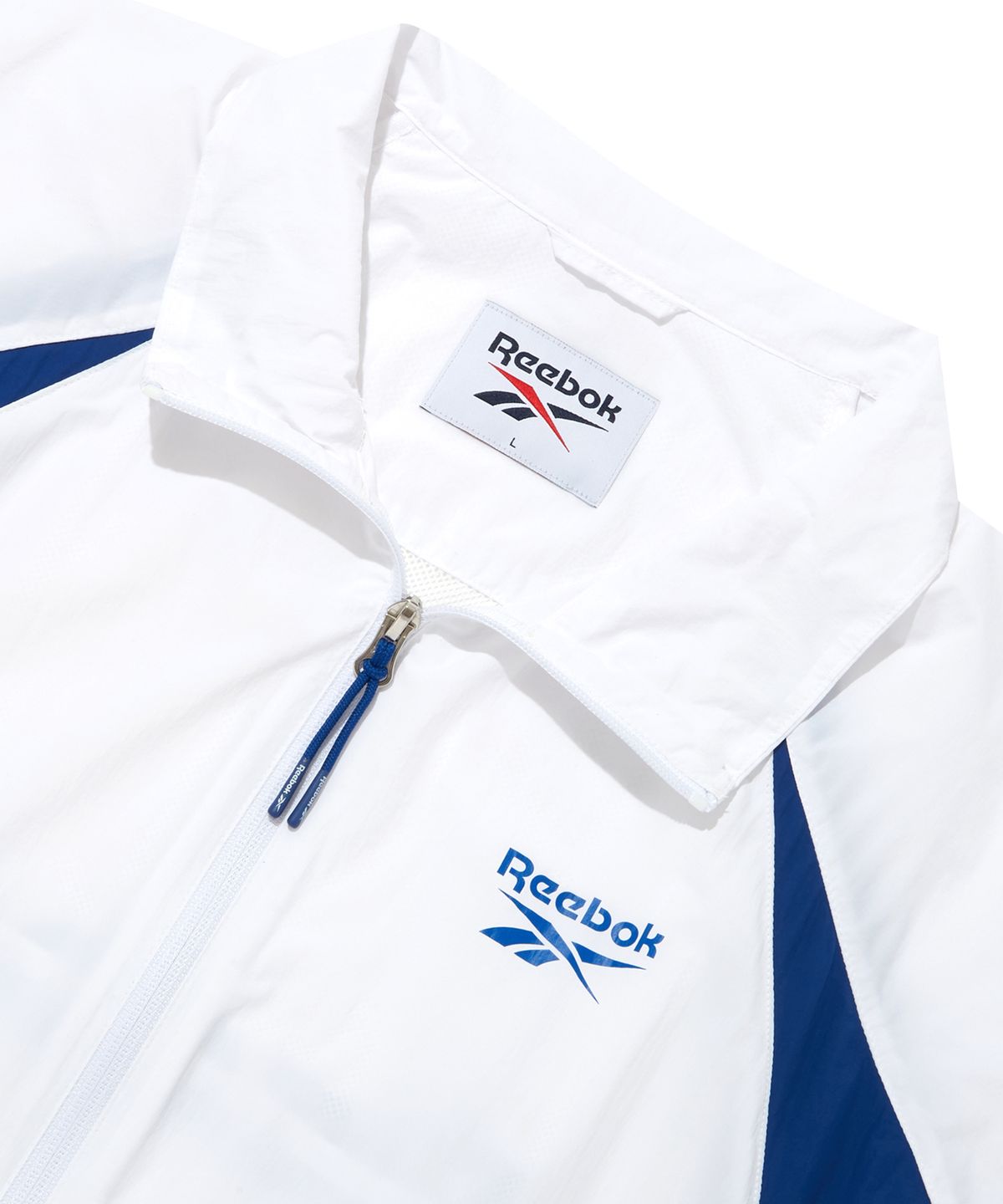 리복(REEBOK) 에센셜 써클 경량 윈드 브레이커 - 화이트:블루