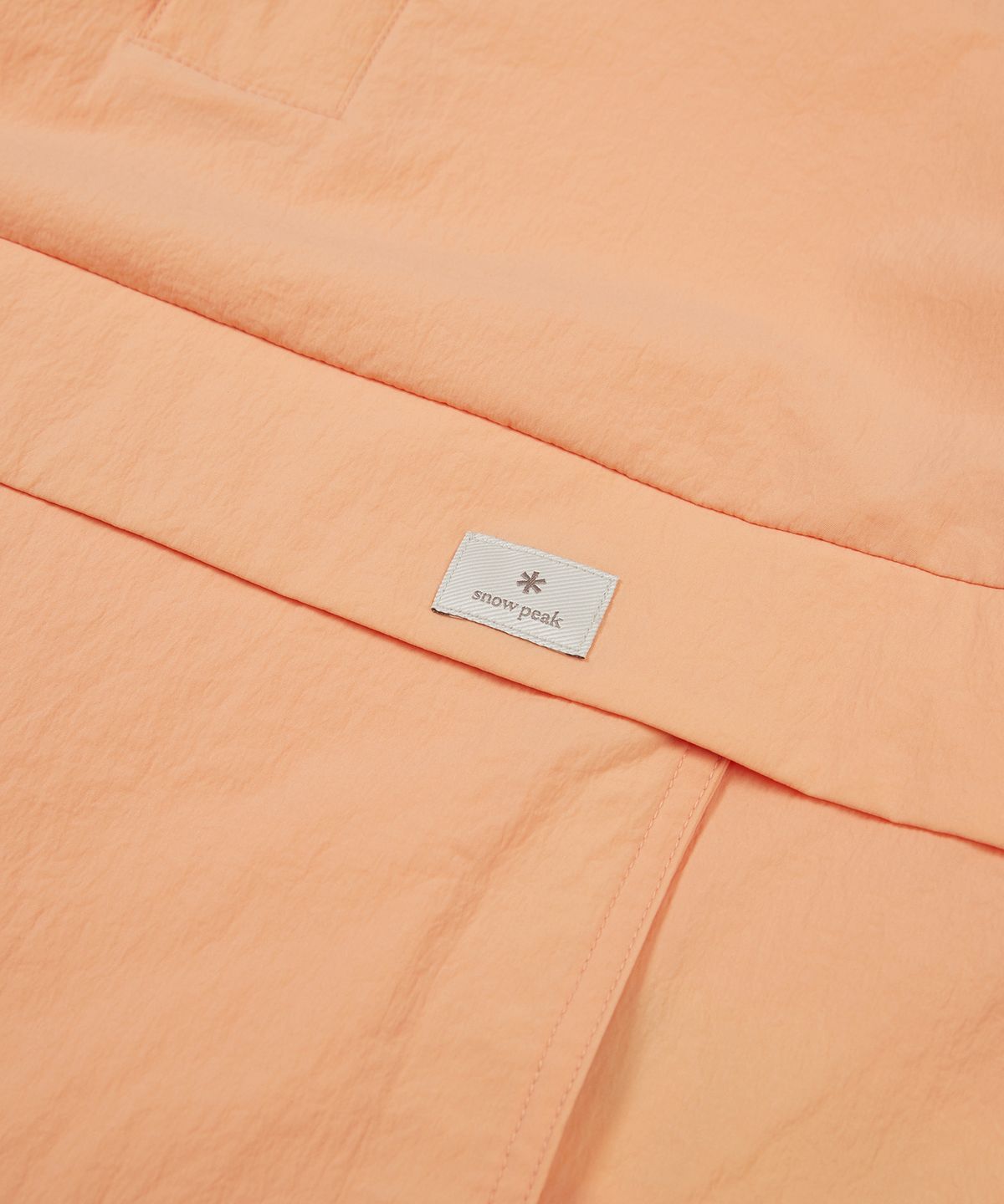 스노우피크 어패럴 키즈(SNOWPEAK APPAREL KIDS) 키즈 루트 스탠드넥 반팔 아노락 Light Orange (S24MKRAN80)