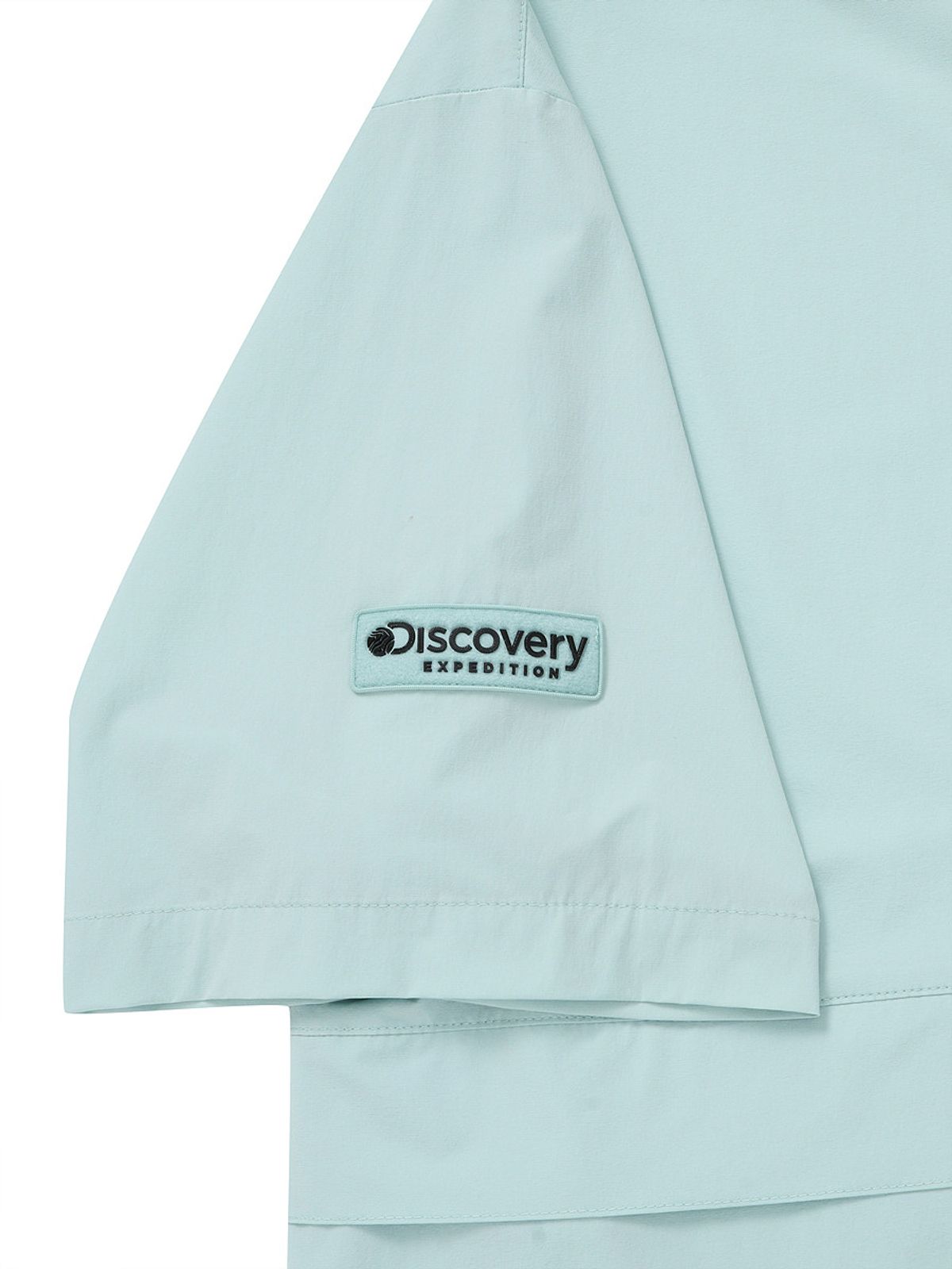 디스커버리 익스페디션(DISCOVERY EXPEDITION) 우븐 폴튼 반팔 후디드 아노락 (EMERALD GREEN)