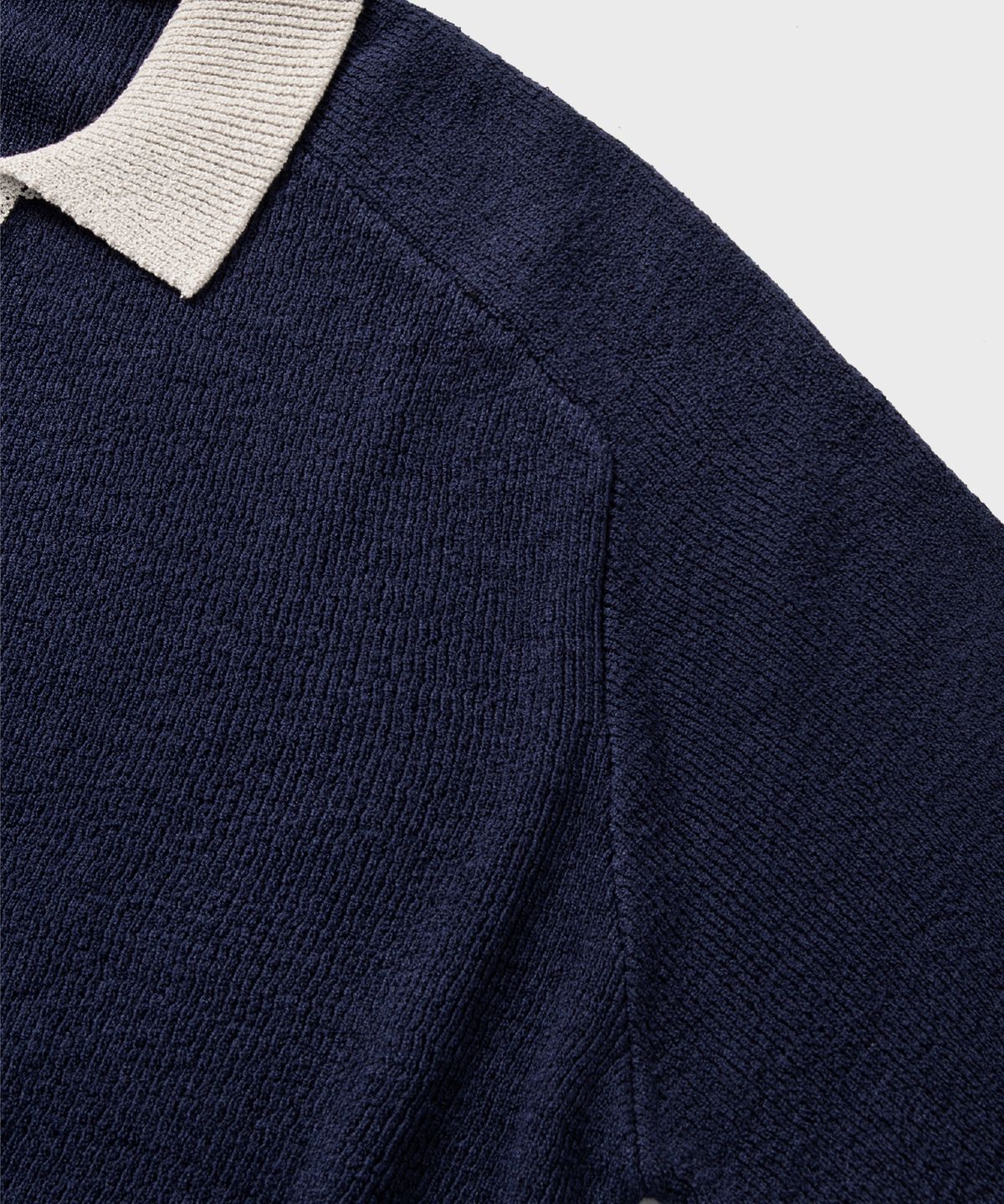 넌블랭크(NONBLANK) 래글런 하프 슬리브 칼라 니트_NAVY