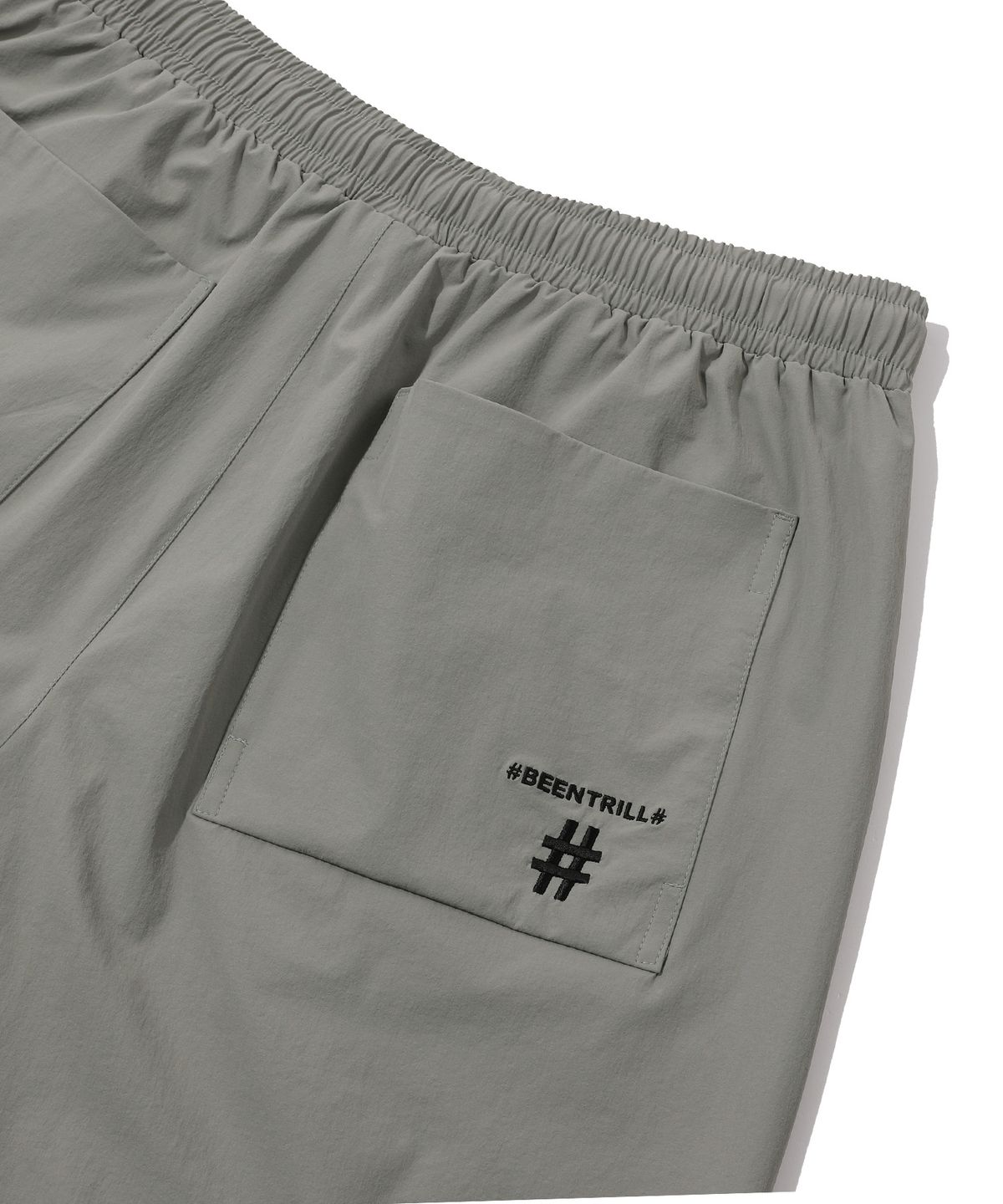 빈트릴(BEENTRILL) 스탠드 카라 아노락 우븐 셋업 와이드핏 쇼츠(웜 그레이)