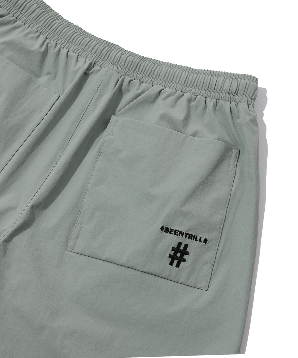 빈트릴(BEENTRILL) 스탠드 카라 아노락 우븐 셋업 와이드핏 쇼츠(블루 그린)