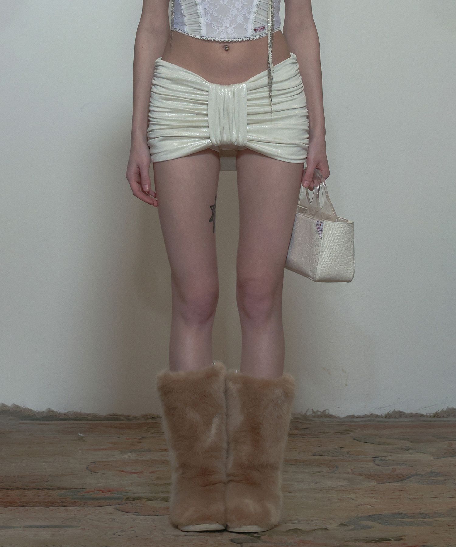 MUSINSA | SCULPTOR Metallic Bow Micro Skort Pearl