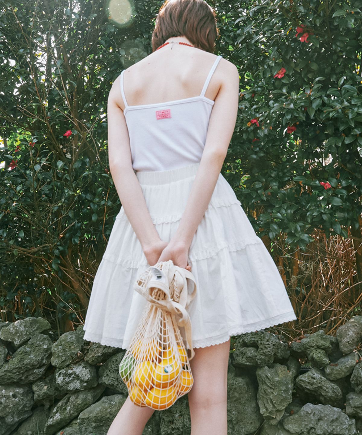 론론(RONRON) HEART BUTTON GOLGI SLEEVELESS WHITE