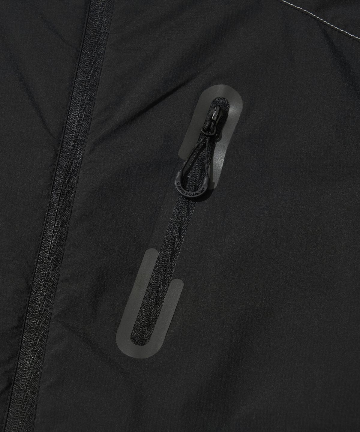 웰터 익스페리먼트(WELTER EXPERIMENT) LIGHT PACKABLE WINDBREAKER_BLACK_WOL058