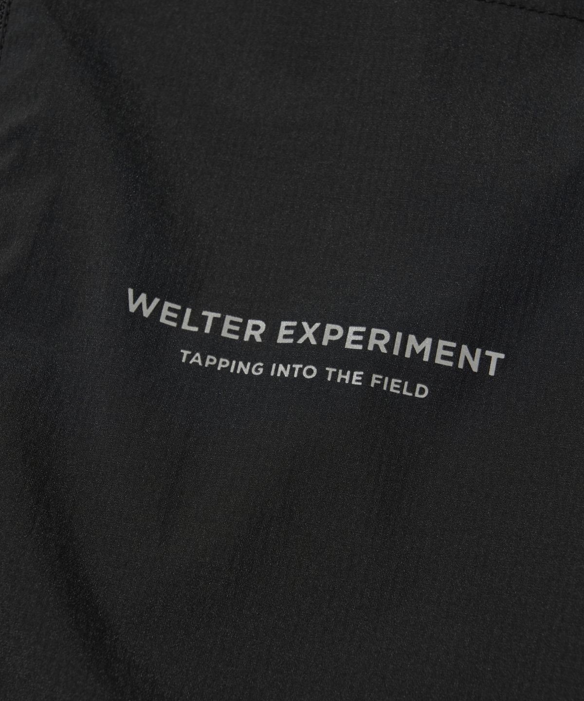 웰터 익스페리먼트(WELTER EXPERIMENT) LIGHT PACKABLE WINDBREAKER_BLACK_WOL058