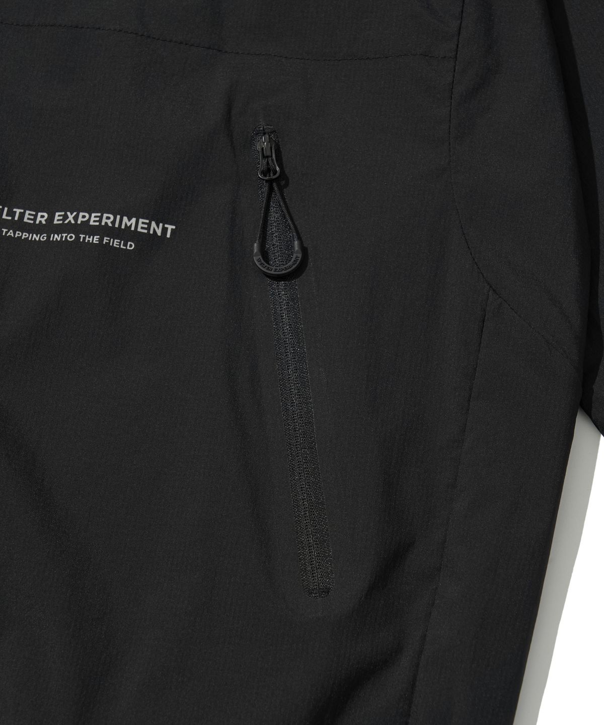 웰터 익스페리먼트(WELTER EXPERIMENT) LIGHT PACKABLE WINDBREAKER_BLACK_WOL058