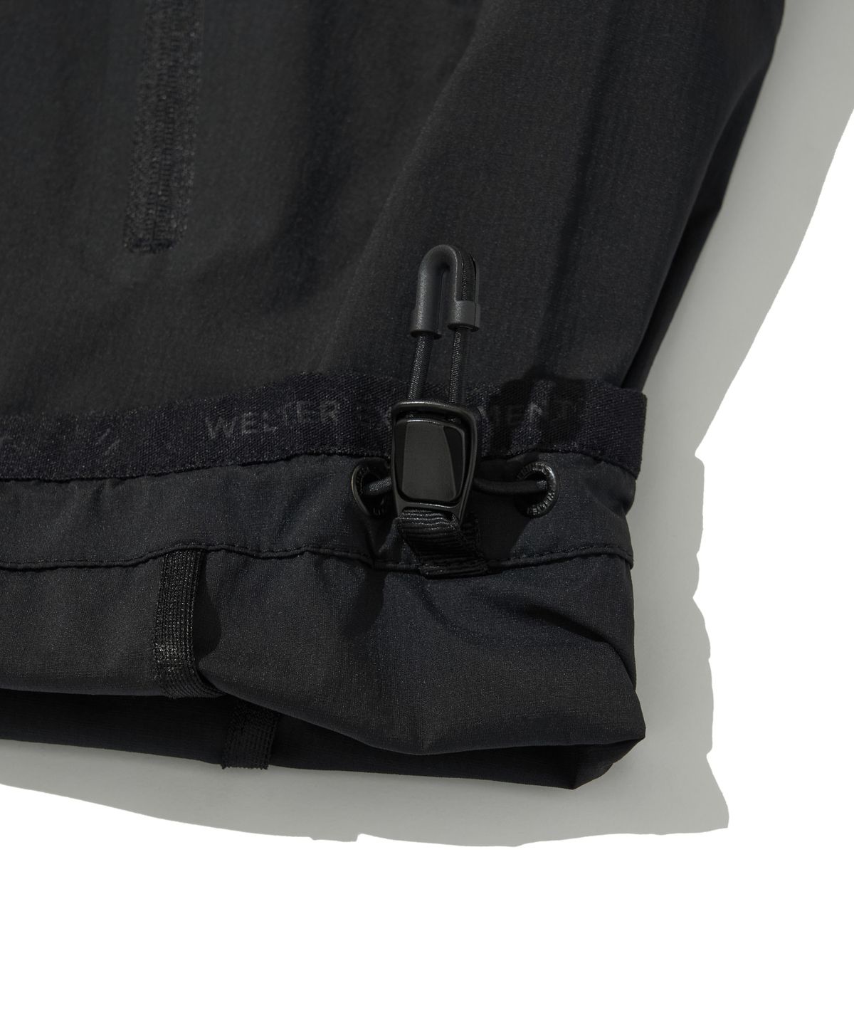 웰터 익스페리먼트(WELTER EXPERIMENT) LIGHT PACKABLE WINDBREAKER_BLACK_WOL058