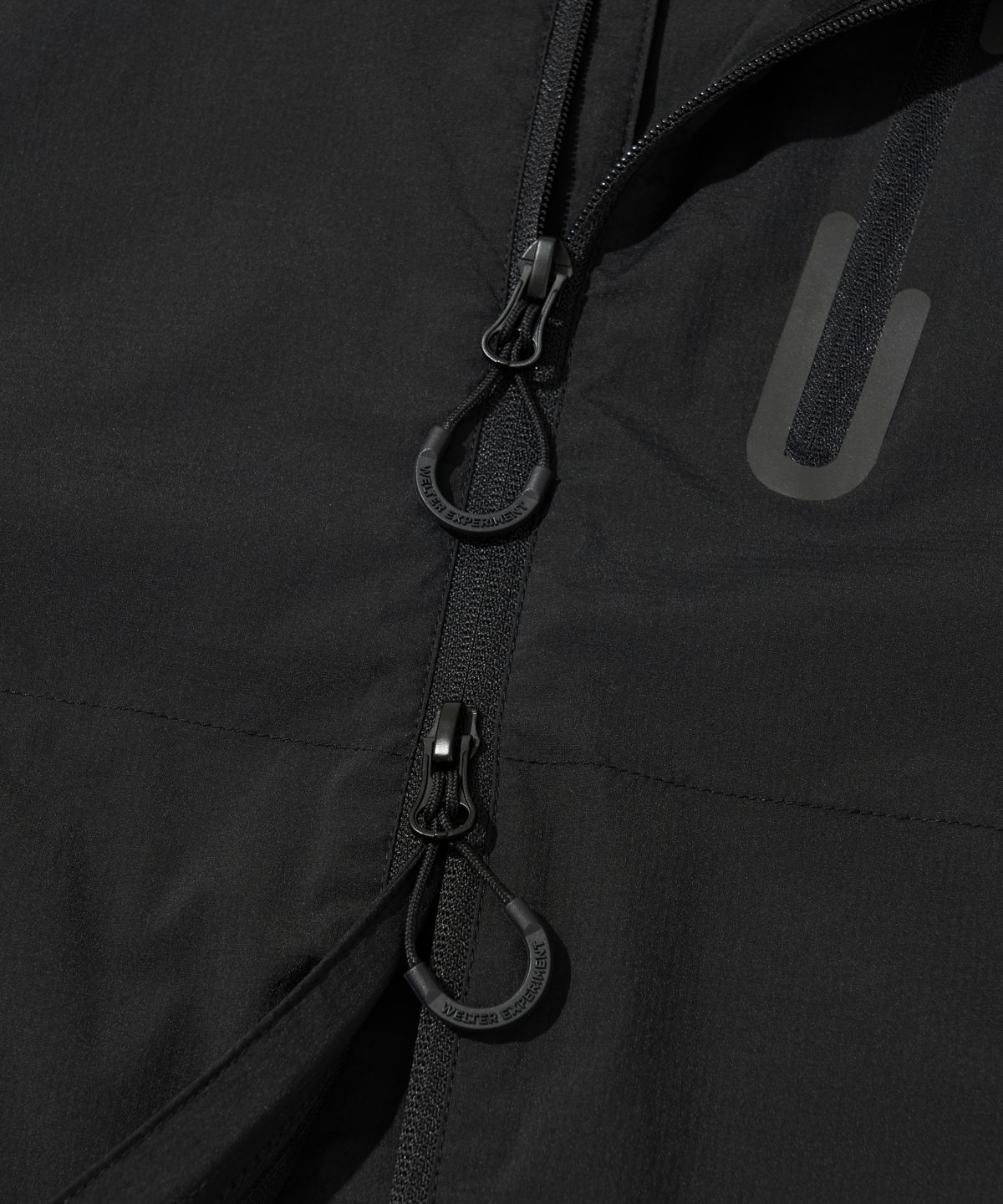 웰터 익스페리먼트(WELTER EXPERIMENT) LIGHT PACKABLE WINDBREAKER_BLACK_WOL058