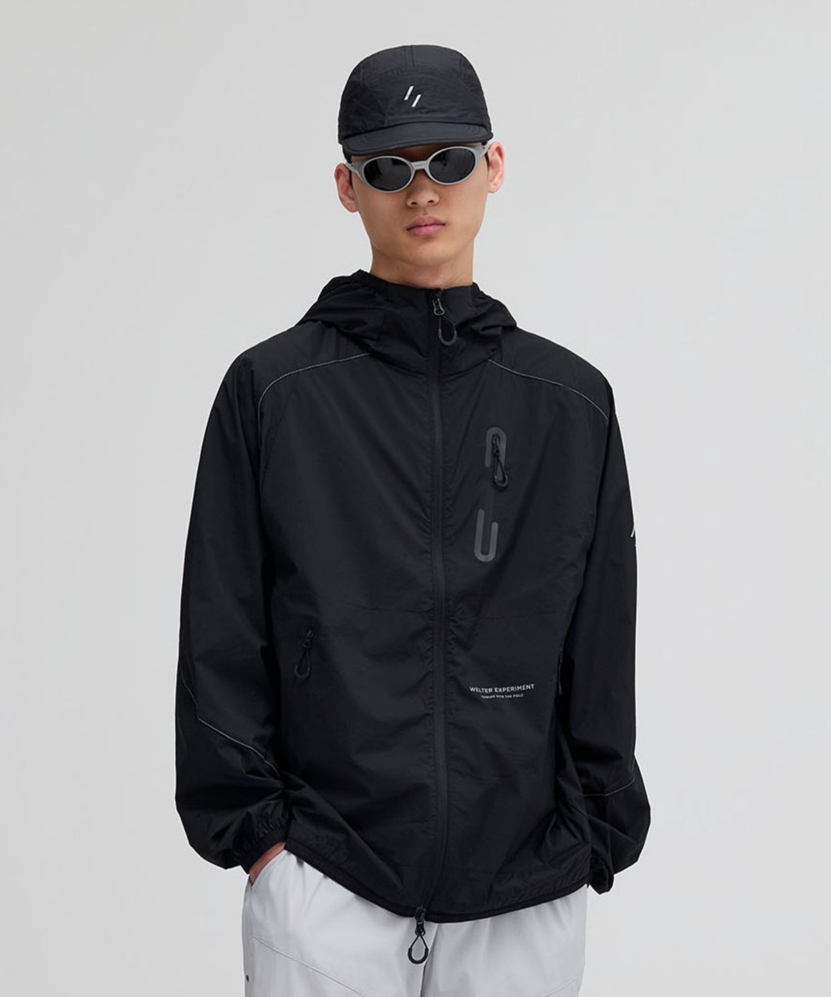 웰터 익스페리먼트(WELTER EXPERIMENT) LIGHT PACKABLE WINDBREAKER_BLACK_WOL058