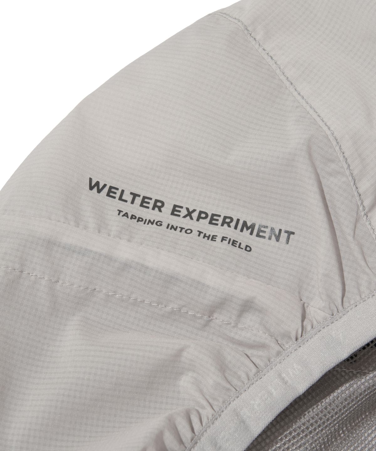 웰터 익스페리먼트(WELTER EXPERIMENT) LIGHT PACKABLE WINDBREAKER_LIGHT GRAY_WOL059