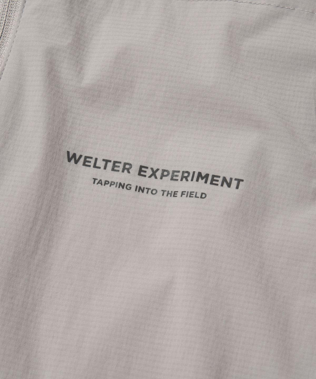웰터 익스페리먼트(WELTER EXPERIMENT) LIGHT PACKABLE WINDBREAKER_LIGHT GRAY_WOL059