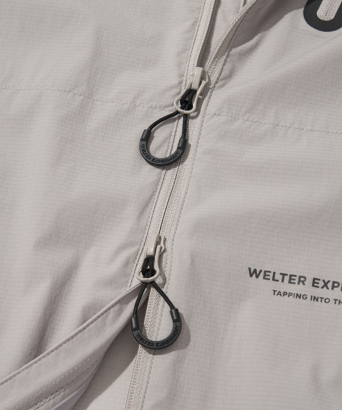 웰터 익스페리먼트(WELTER EXPERIMENT) LIGHT PACKABLE WINDBREAKER_LIGHT GRAY_WOL059