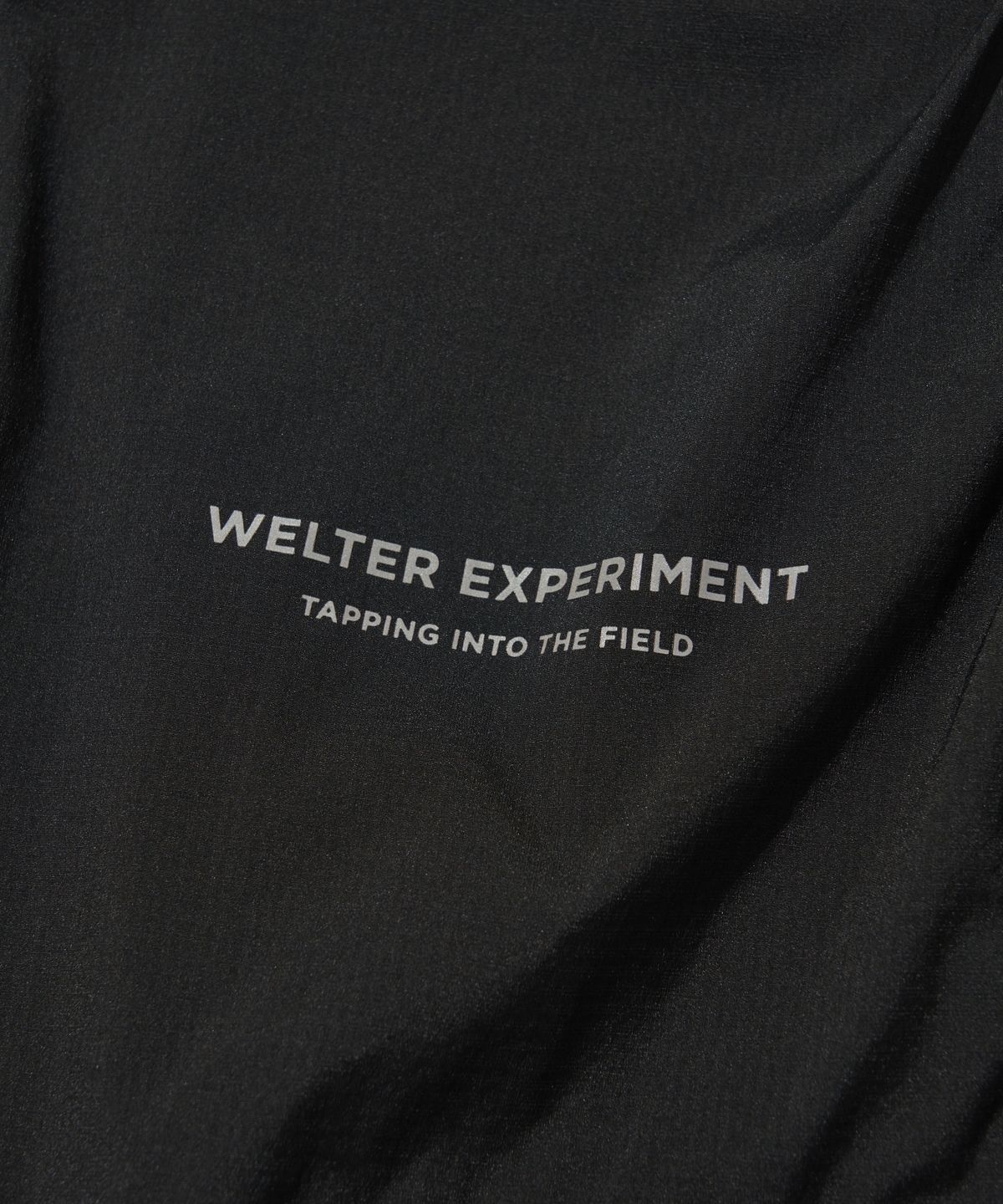 웰터 익스페리먼트(WELTER EXPERIMENT) DETACHABLE LIGHT WINDBREAKER_BLACK_WOL061
