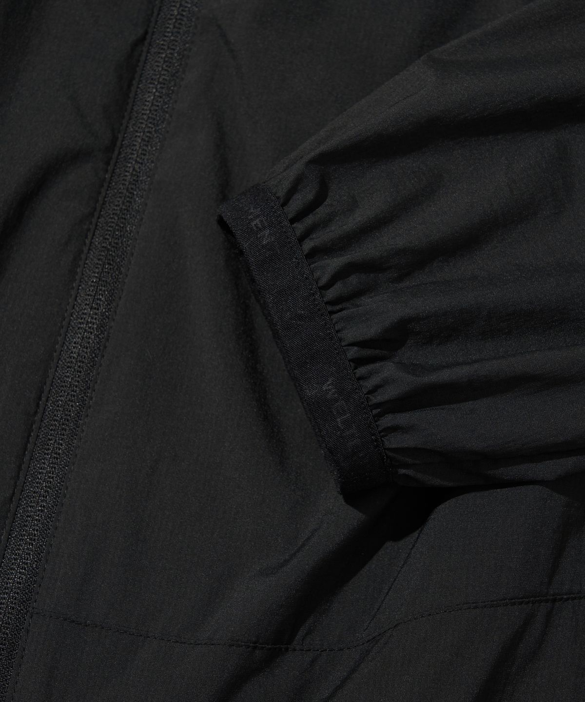 웰터 익스페리먼트(WELTER EXPERIMENT) DETACHABLE LIGHT WINDBREAKER_BLACK_WOL061