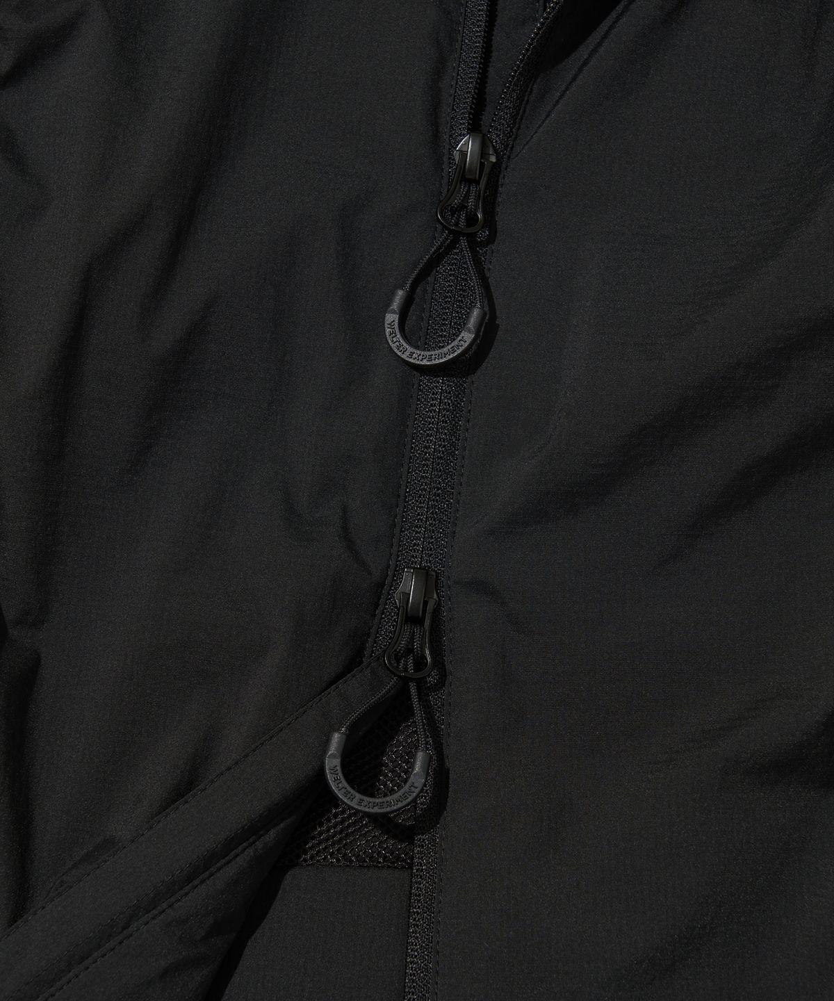 웰터 익스페리먼트(WELTER EXPERIMENT) DETACHABLE LIGHT WINDBREAKER_BLACK_WOL061