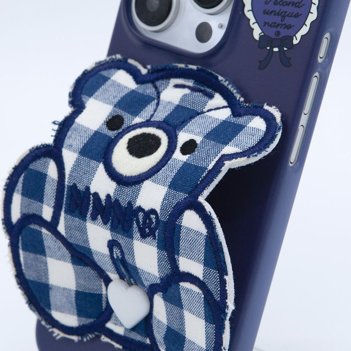 세컨드유니크네임(SECOND UNIQUE NAME) SUN CASE PATCH CHECK BEAR NAVY