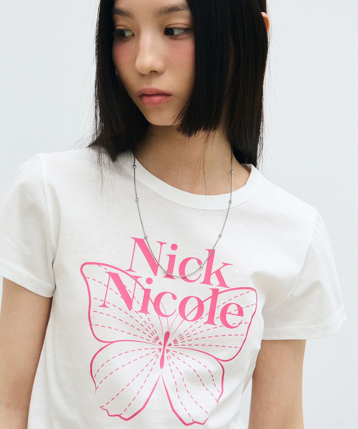 닉앤니콜(NICK&NICOLE) BUTTERFLY SIGNATURE CROP TOP_WHITE PINK