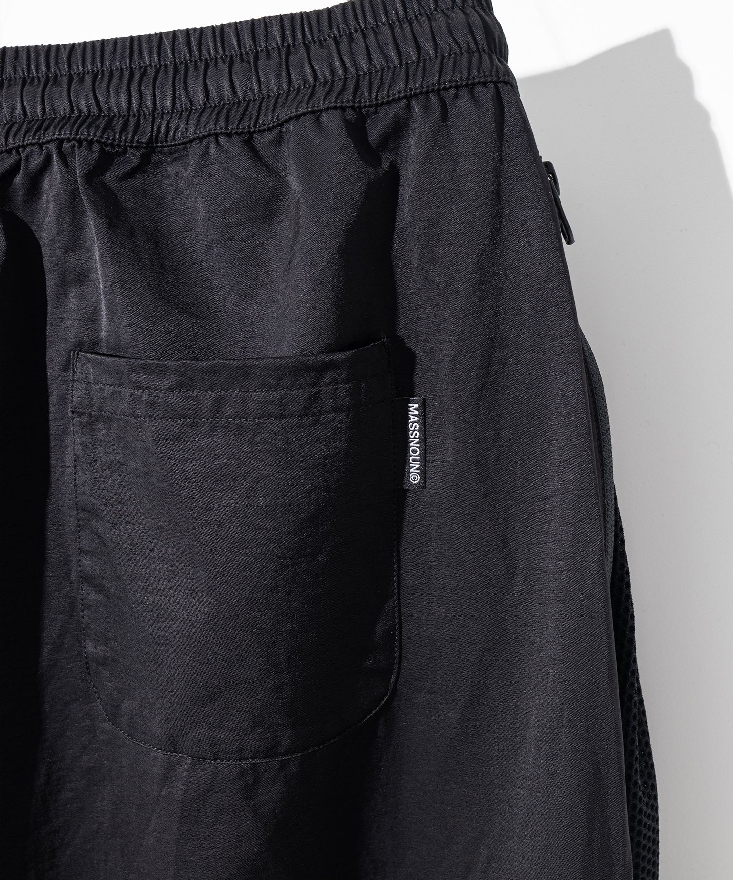MUSINSA | MASSNOUN Curved One-Tuck Pleats Mesh Track Pants