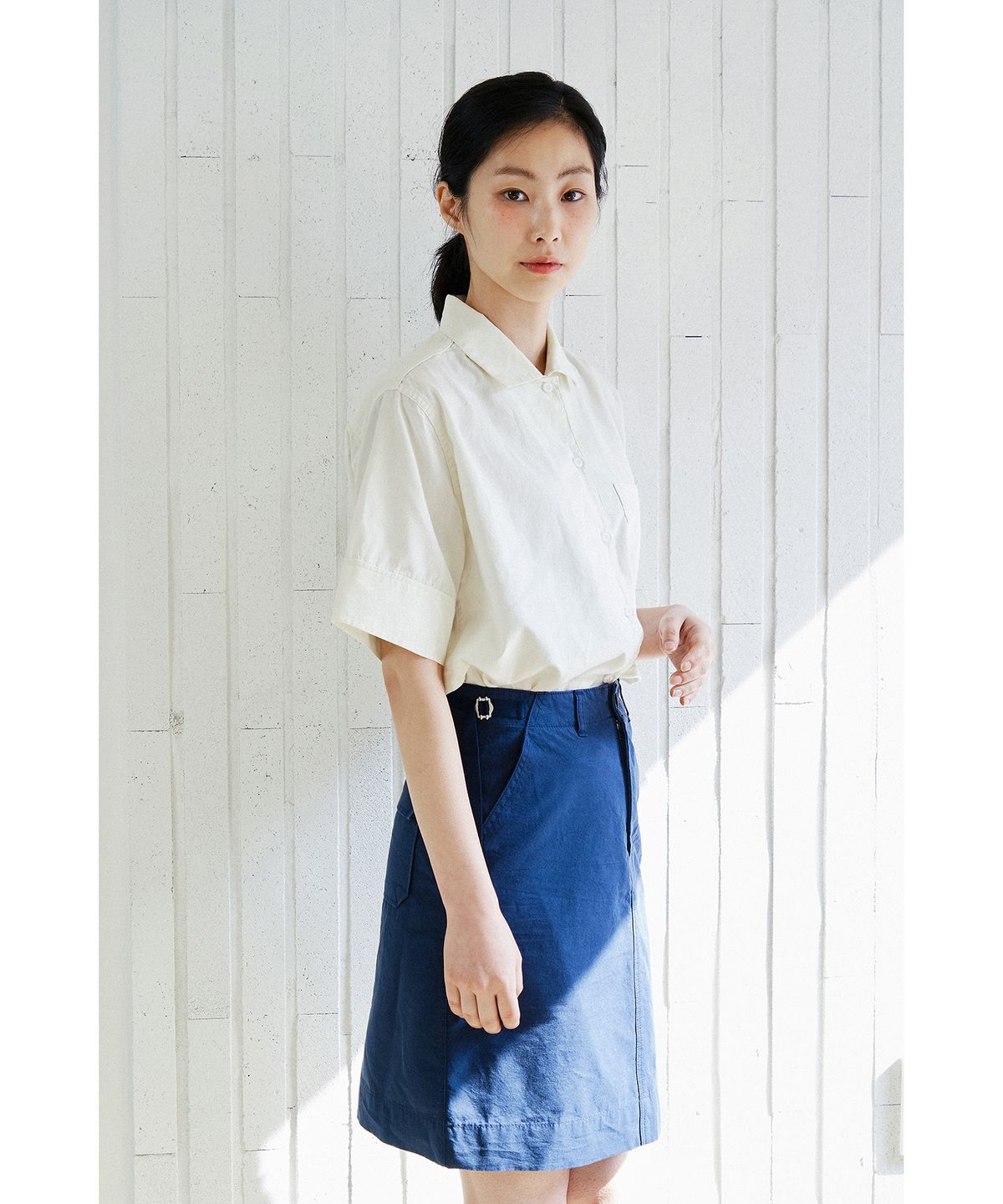 코튼벨(COTTON BELL) 미디 사이드 벨트 스커트 - Navy