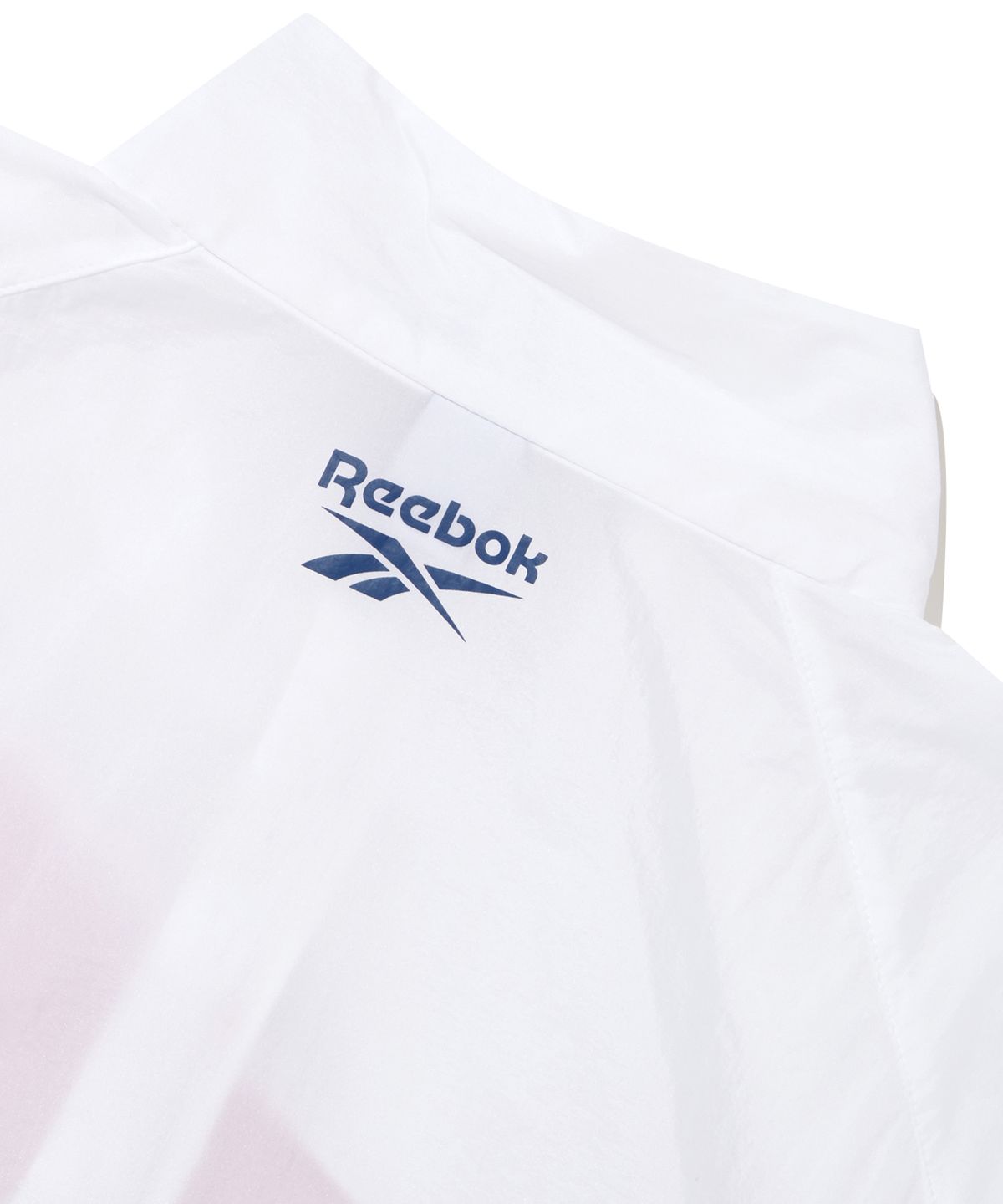 리복(REEBOK) 패널드 벡터 반팔 아노락 - 화이트:터키쉬 블루