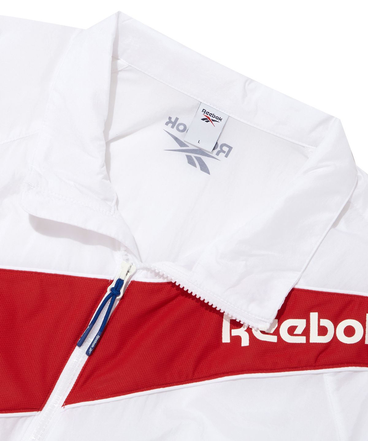 리복(REEBOK) 패널드 벡터 반팔 아노락 - 화이트:터키쉬 블루
