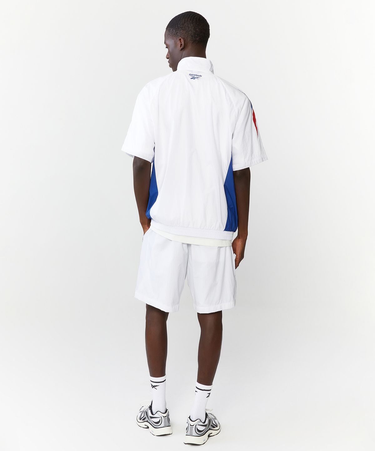 리복(REEBOK) 패널드 벡터 반팔 아노락 - 화이트:터키쉬 블루
