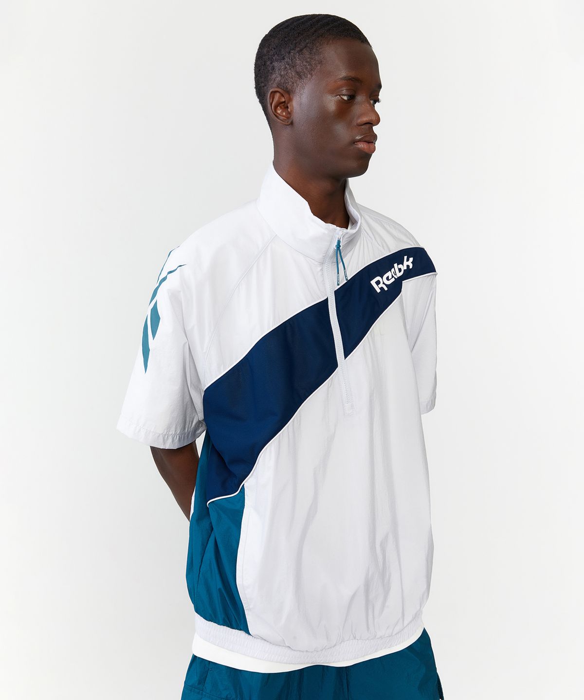 리복(REEBOK) 패널드 벡터 반팔 아노락 - 그레이