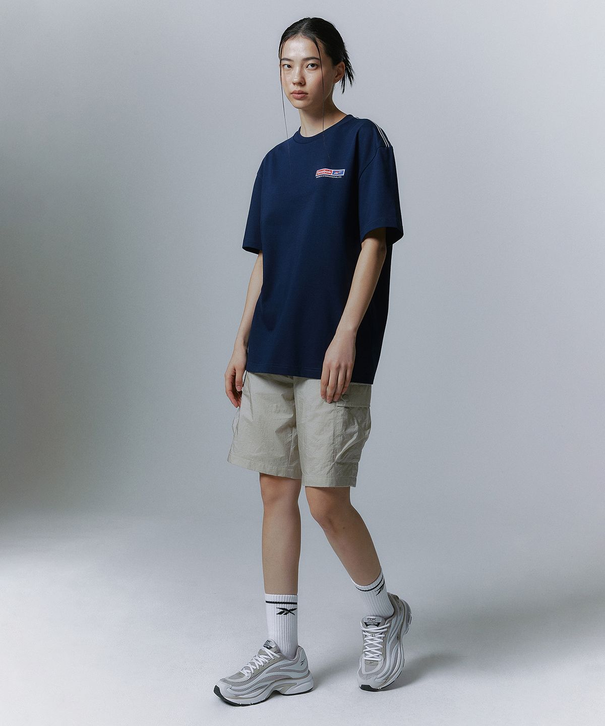 리복(REEBOK) 경량 카고 쇼츠 - 베이지