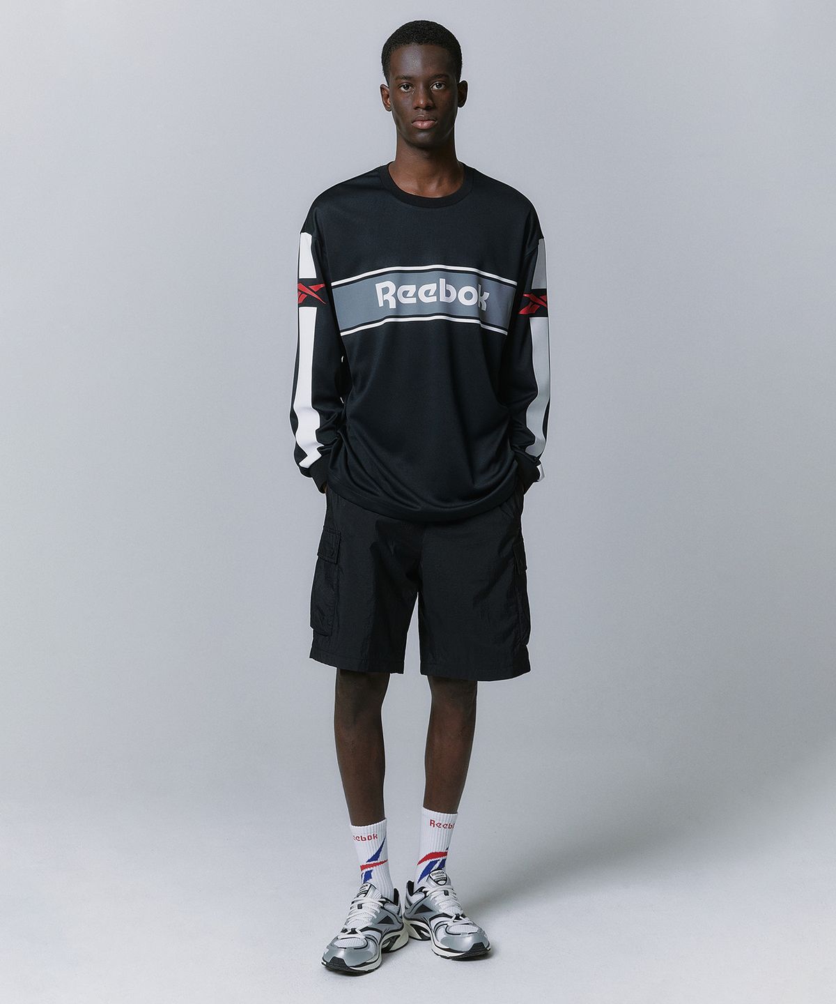리복(REEBOK) 경량 카고 쇼츠 - 블랙