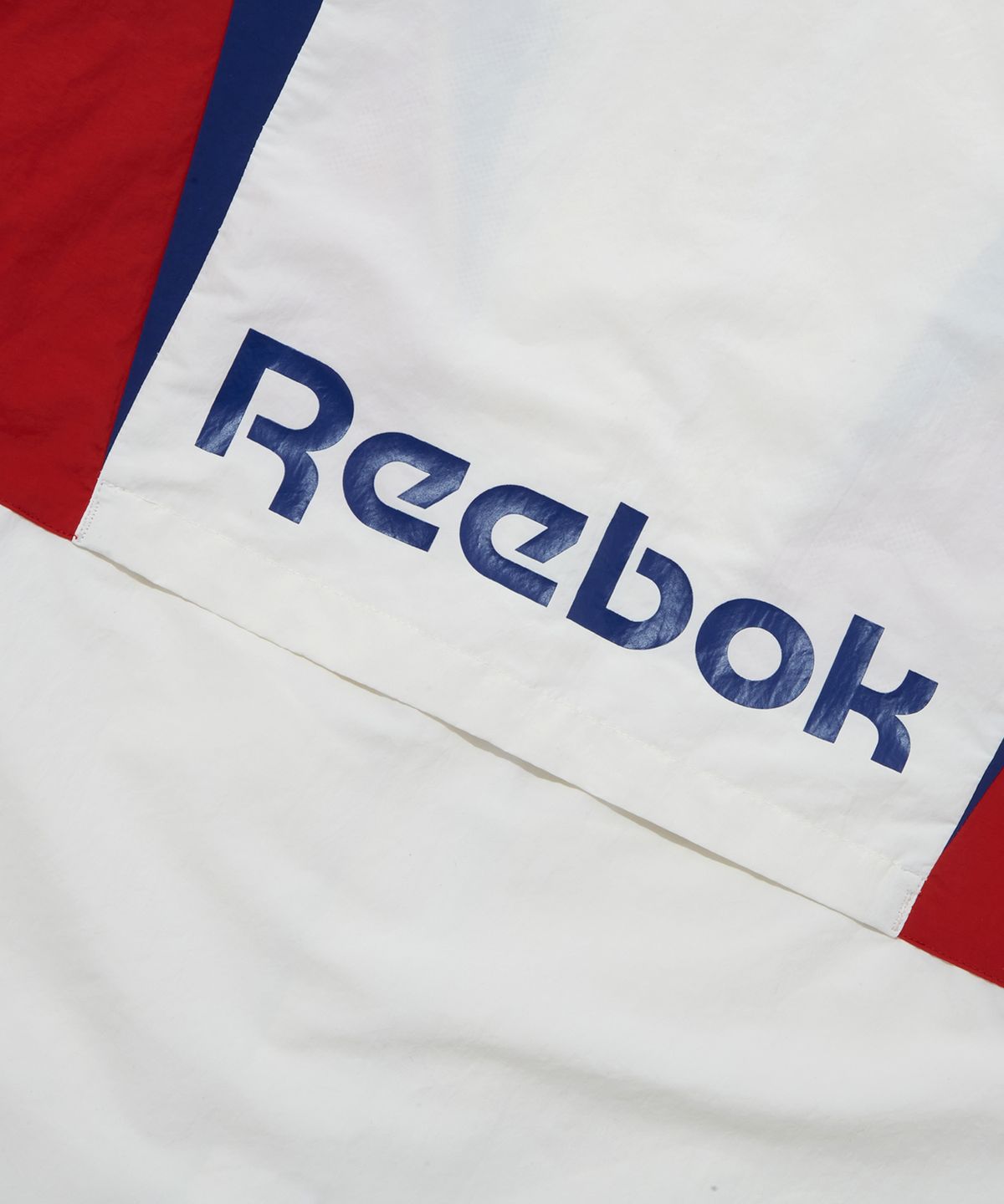 리복(REEBOK) 트윈 벡터 윈드 브레이커 - 오프 화이트