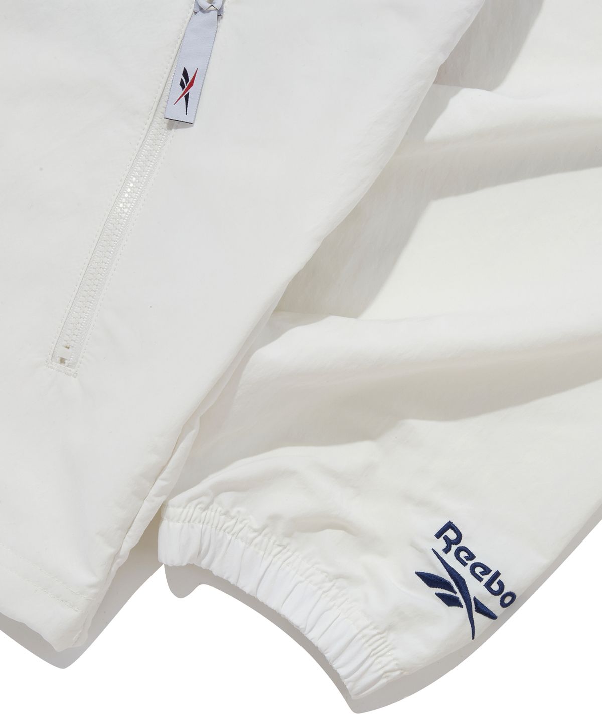 리복(REEBOK) 트윈 벡터 윈드 브레이커 - 오프 화이트