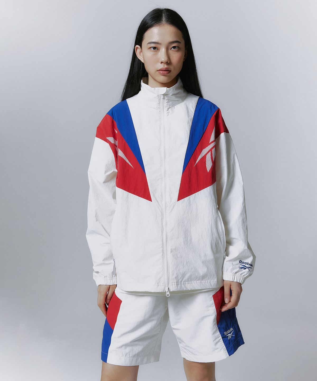 리복(REEBOK) 트윈 벡터 윈드 브레이커 - 오프 화이트