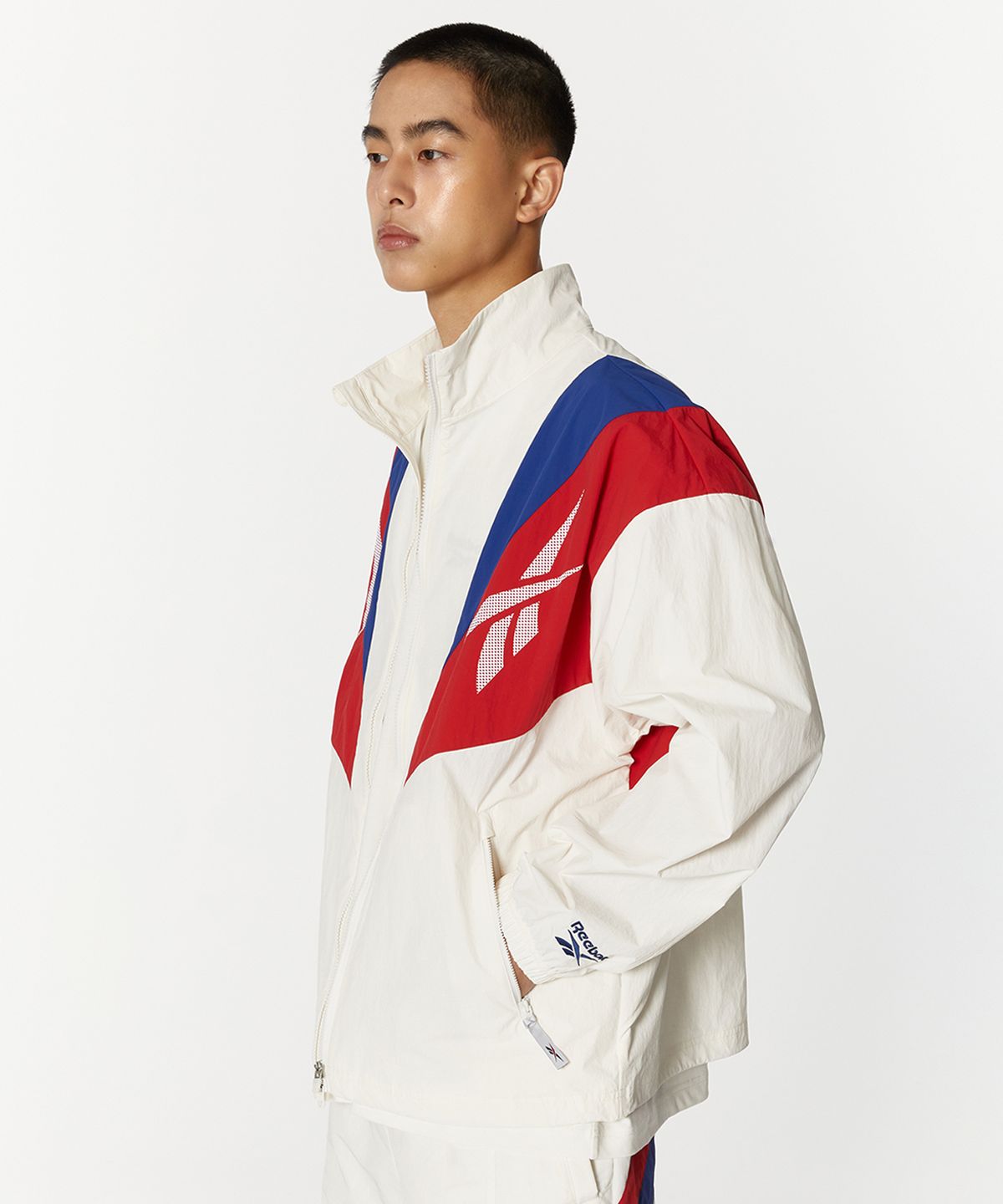 리복(REEBOK) 트윈 벡터 윈드 브레이커 - 오프 화이트