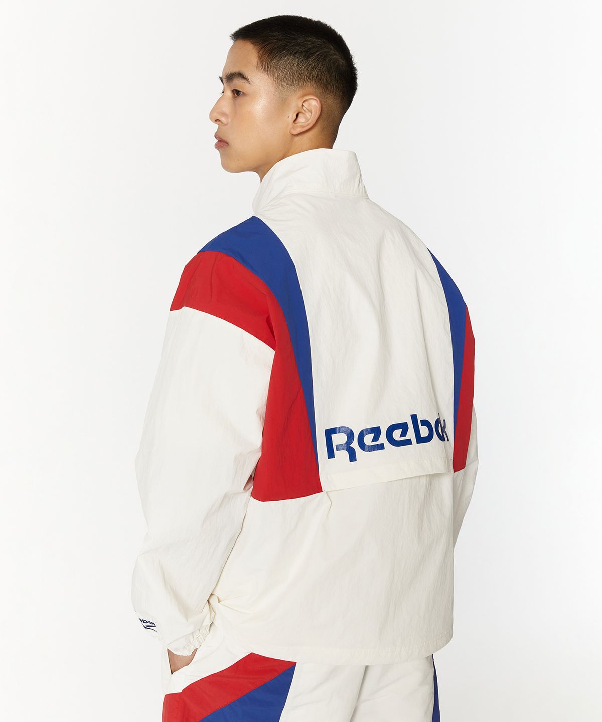 리복(REEBOK) 트윈 벡터 윈드 브레이커 - 오프 화이트
