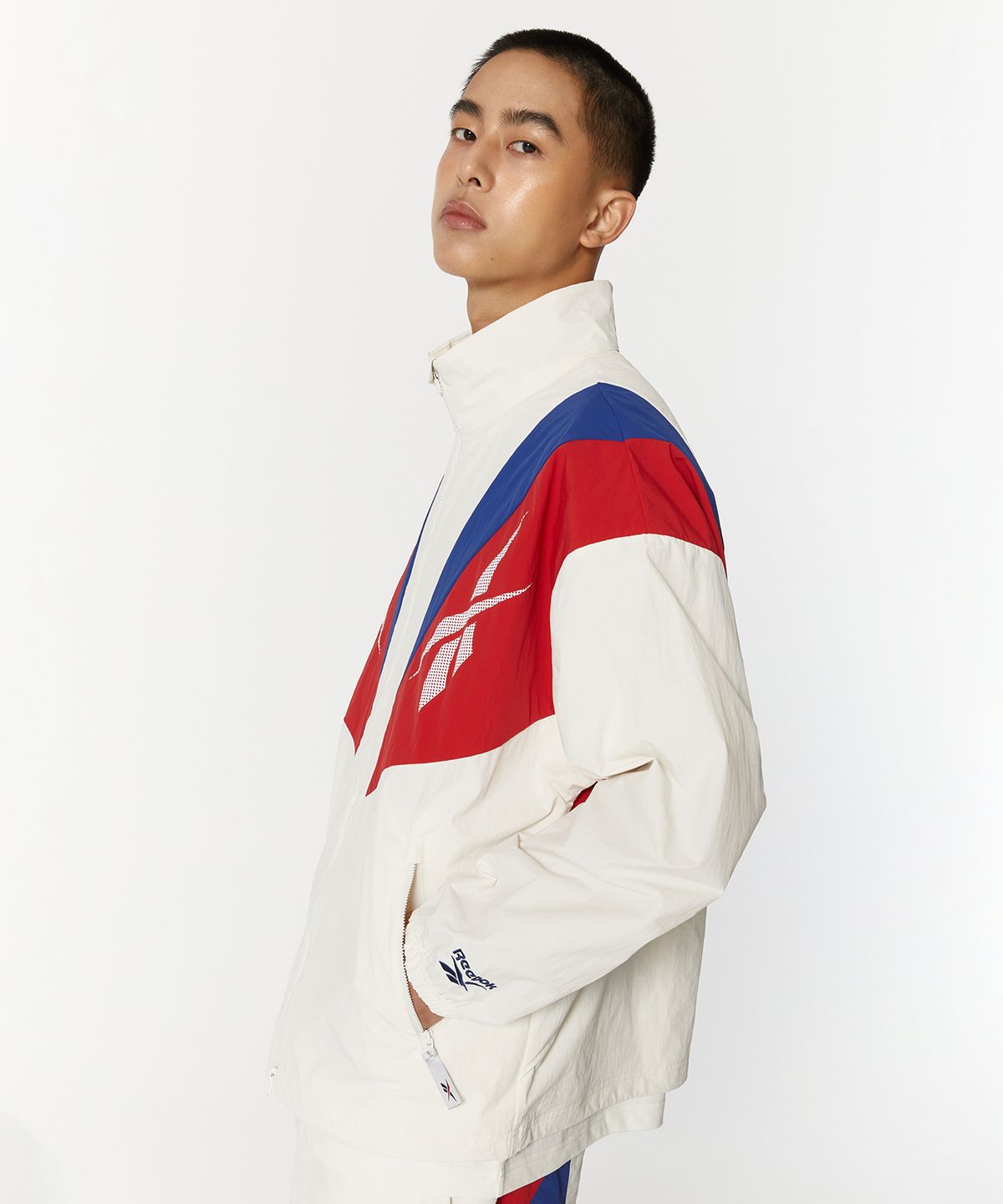 리복(REEBOK) 트윈 벡터 윈드 브레이커 - 오프 화이트