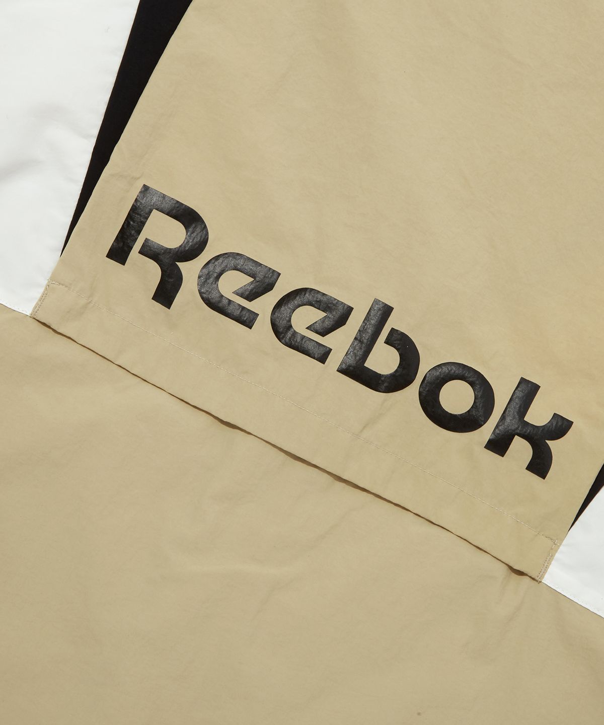 리복(REEBOK) 트윈 벡터 윈드 브레이커 - 베이지