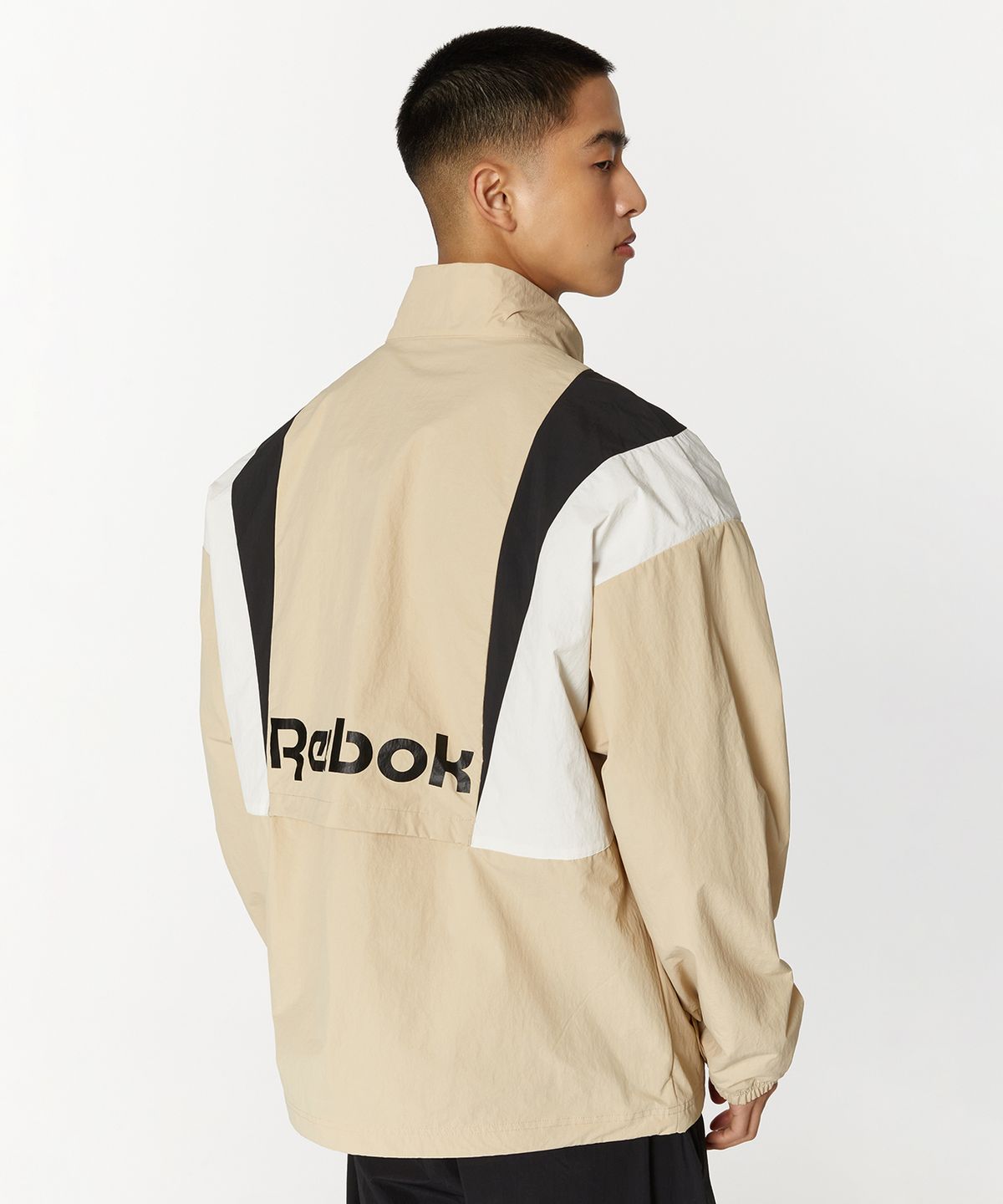 리복(REEBOK) 트윈 벡터 윈드 브레이커 - 베이지