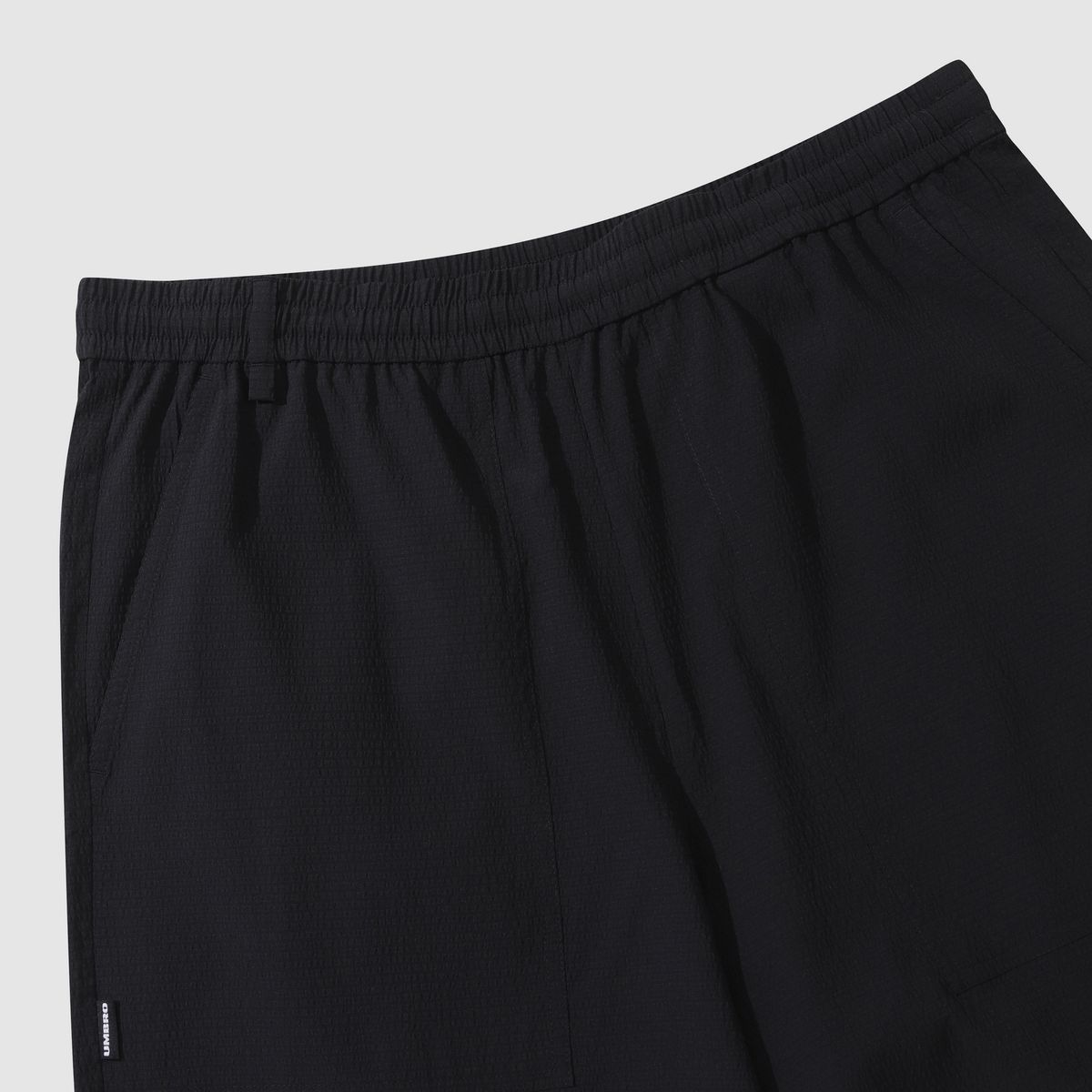 엄브로(UMBRO) 시어서커 4.5부 반바지 블랙(UQ223CHP63)