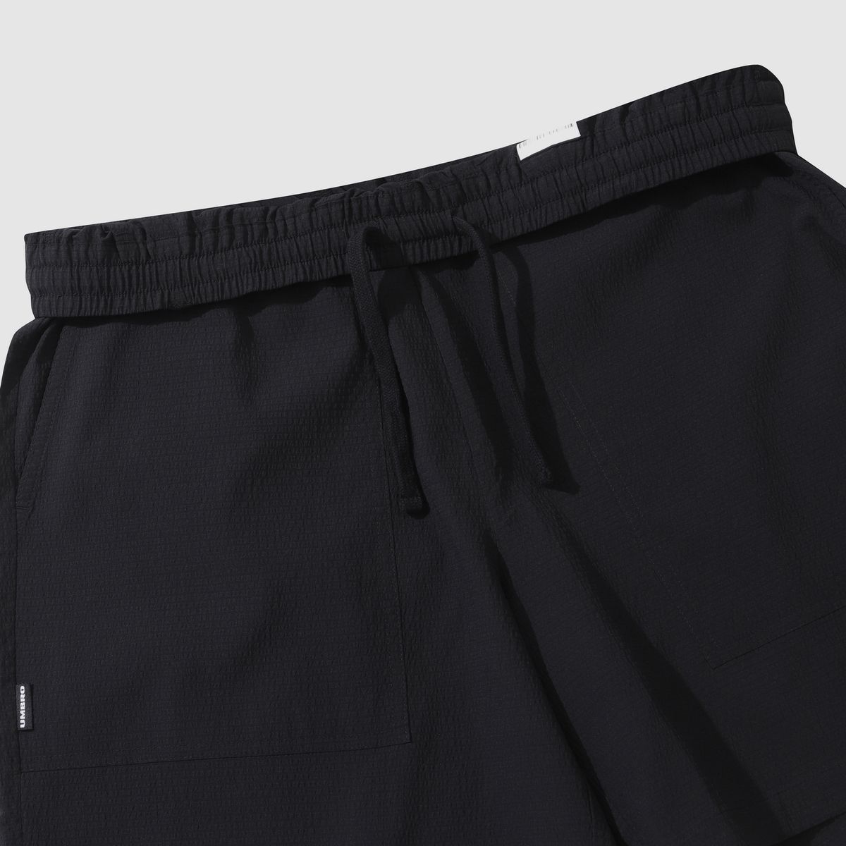 엄브로(UMBRO) 시어서커 4.5부 반바지 블랙(UQ223CHP63)