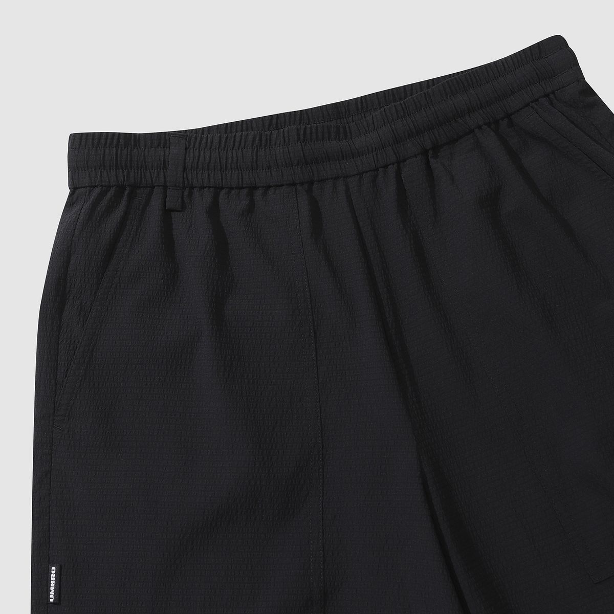 엄브로(UMBRO) 시어서커 4.5부 반바지 블랙(UQ223CHP63)