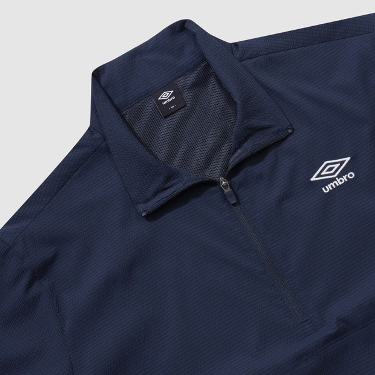 엄브로(UMBRO) 시어서커 반팔 스탠넥 아노락 네이비(UQ221CWT63)