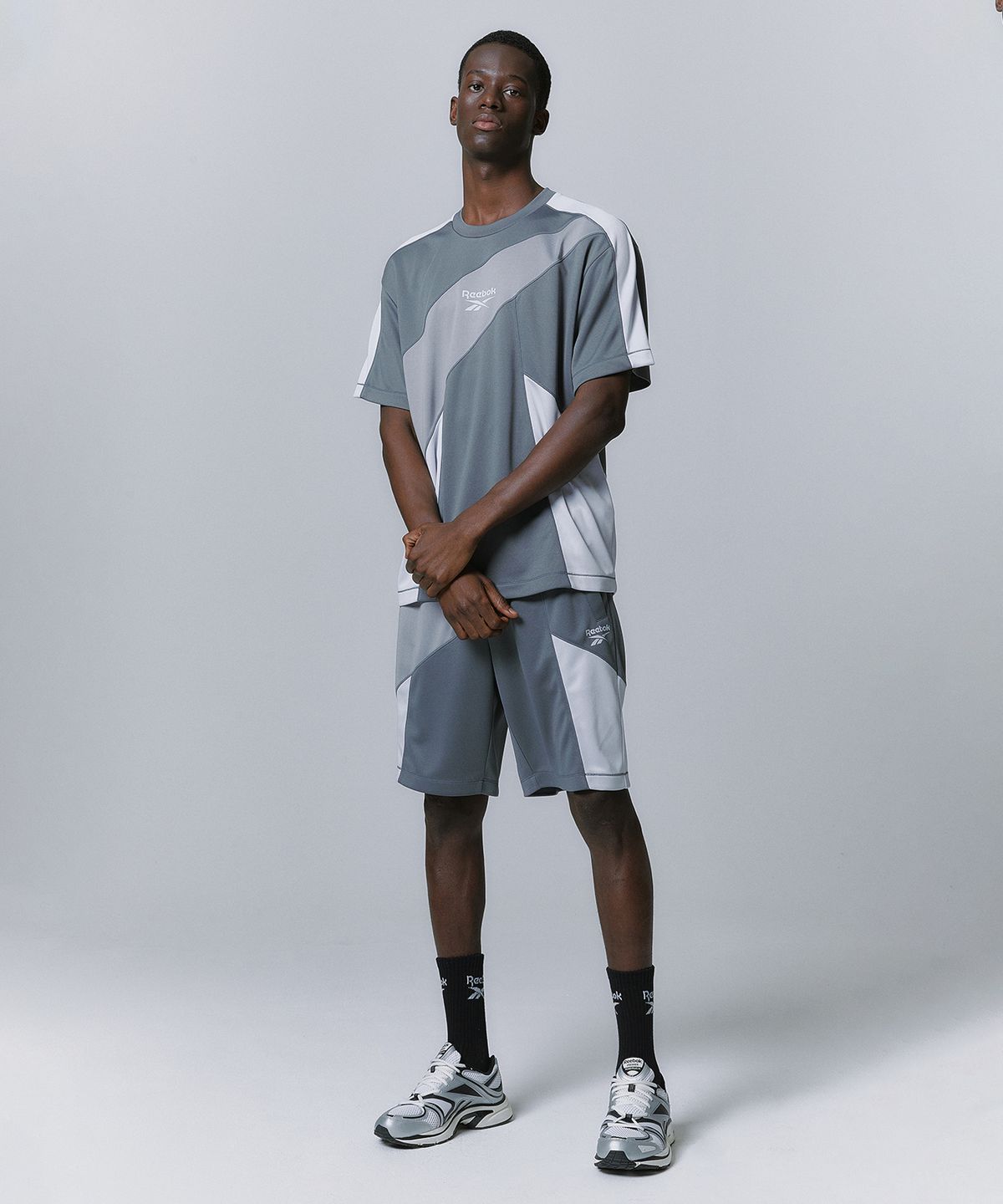 리복(REEBOK) 패널드 벡터 메쉬 티셔츠 - 그레이