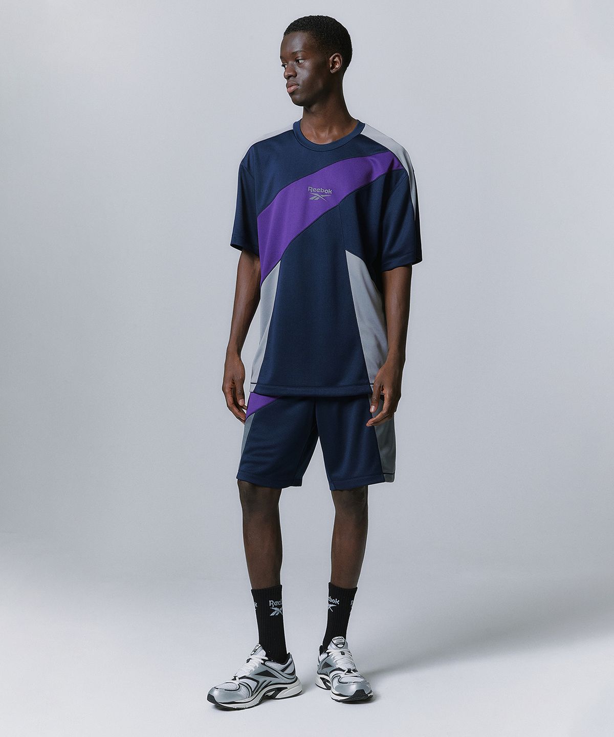 리복(REEBOK) 패널드 벡터 메쉬 티셔츠 - 네이비